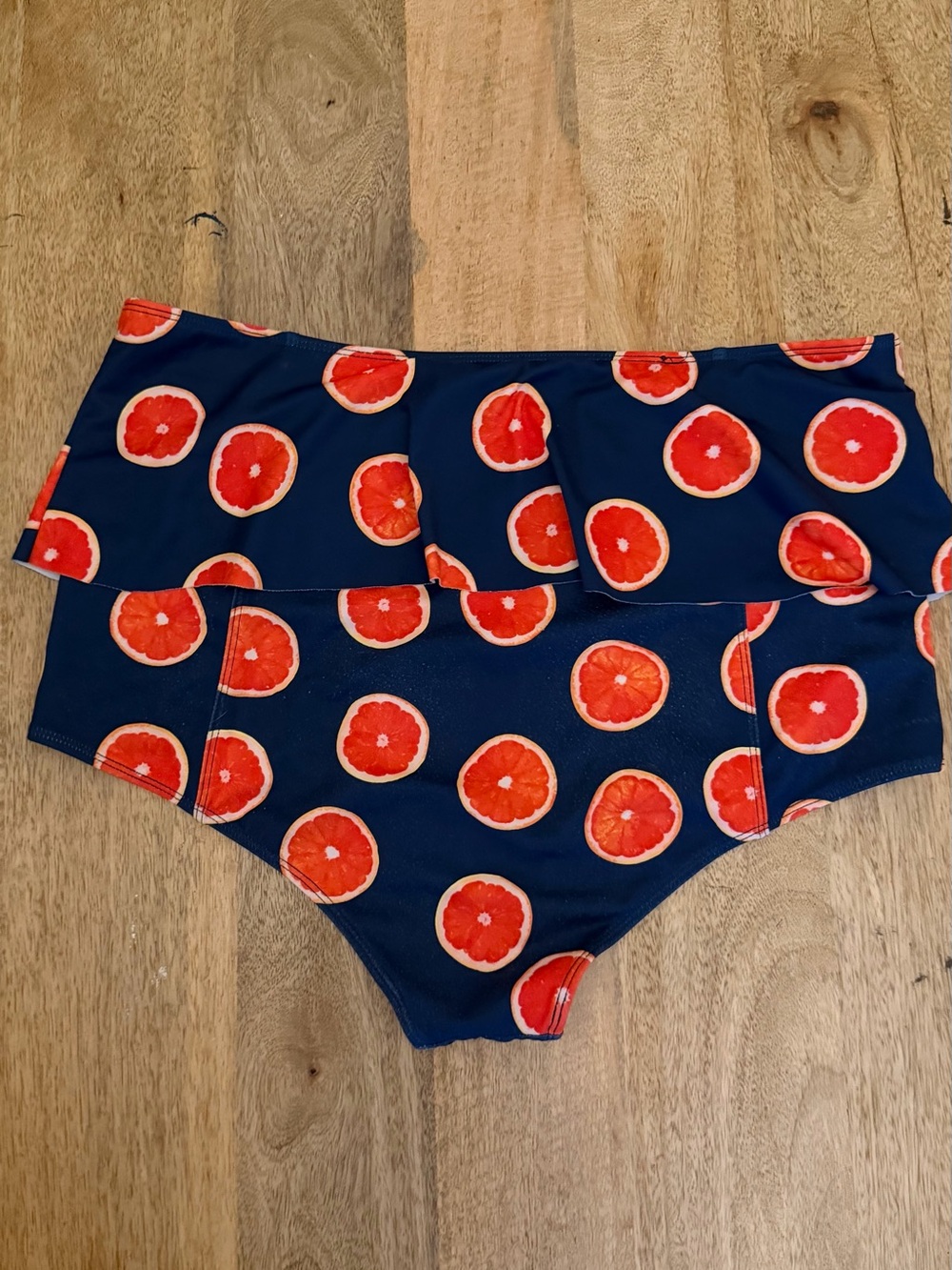 Kortni Jeane Navy Bikini Bottoms with Red-Orange Citrus Print - Picture 2 of 3